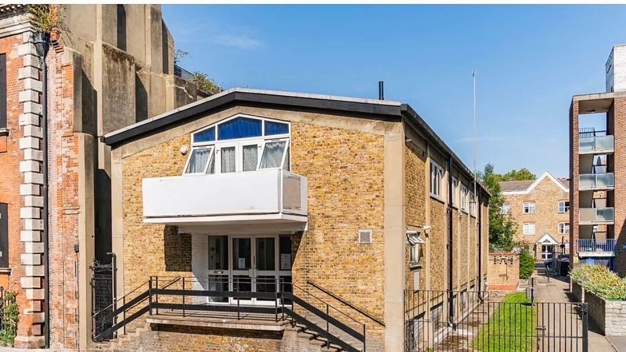 The plain brick building that houses the studio